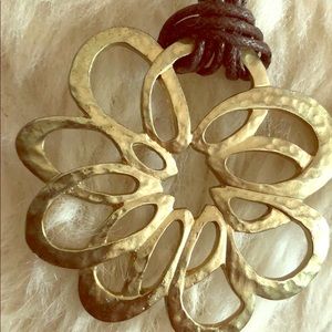 Multi strand leather gold plated necklace.